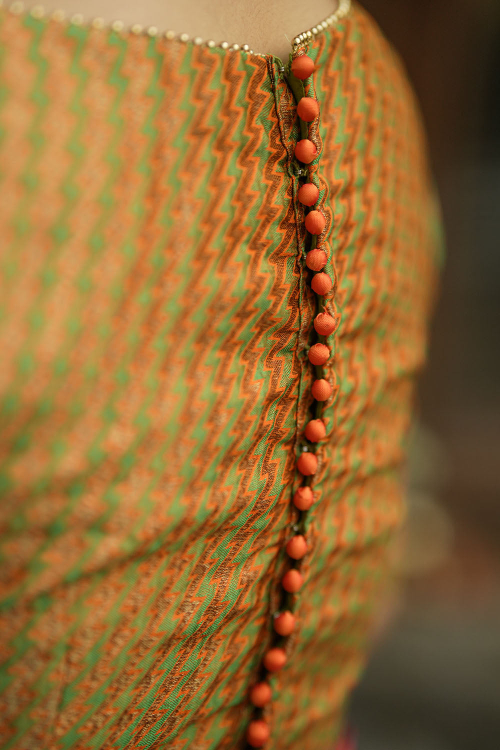 Green jacquard orange brocade boatneck blouse with plain silk detailing