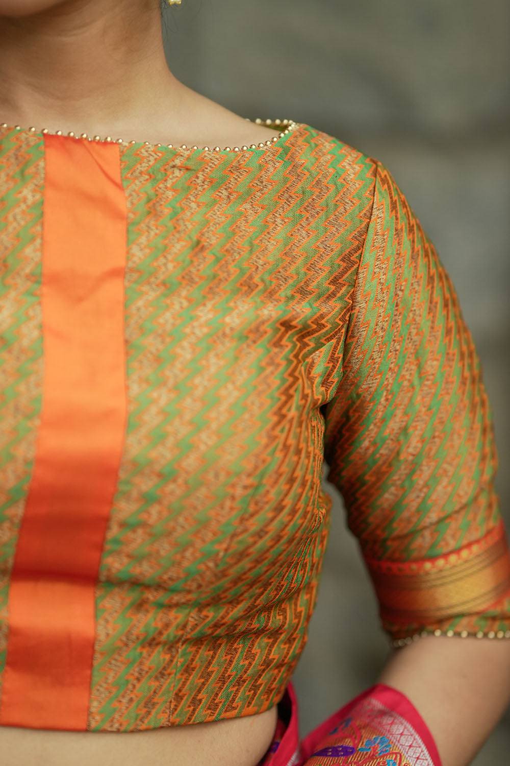 Green jacquard orange brocade boatneck blouse with plain silk detailing