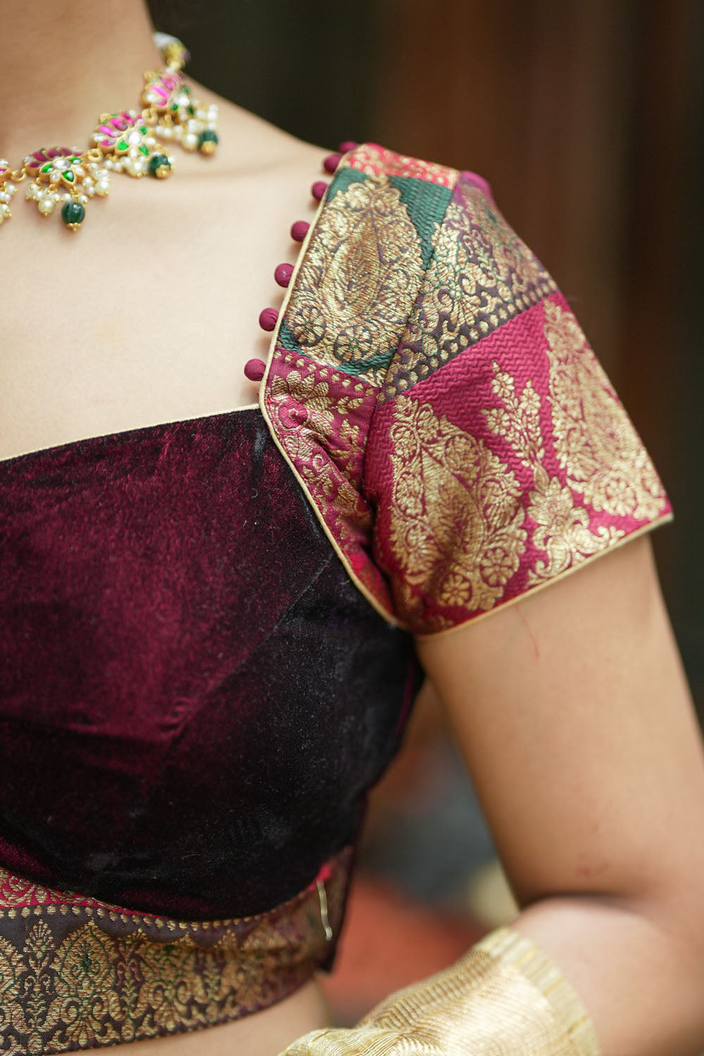 Burgundy velvet and banarasi brocade sweetheart neck blouse with potli button detailing