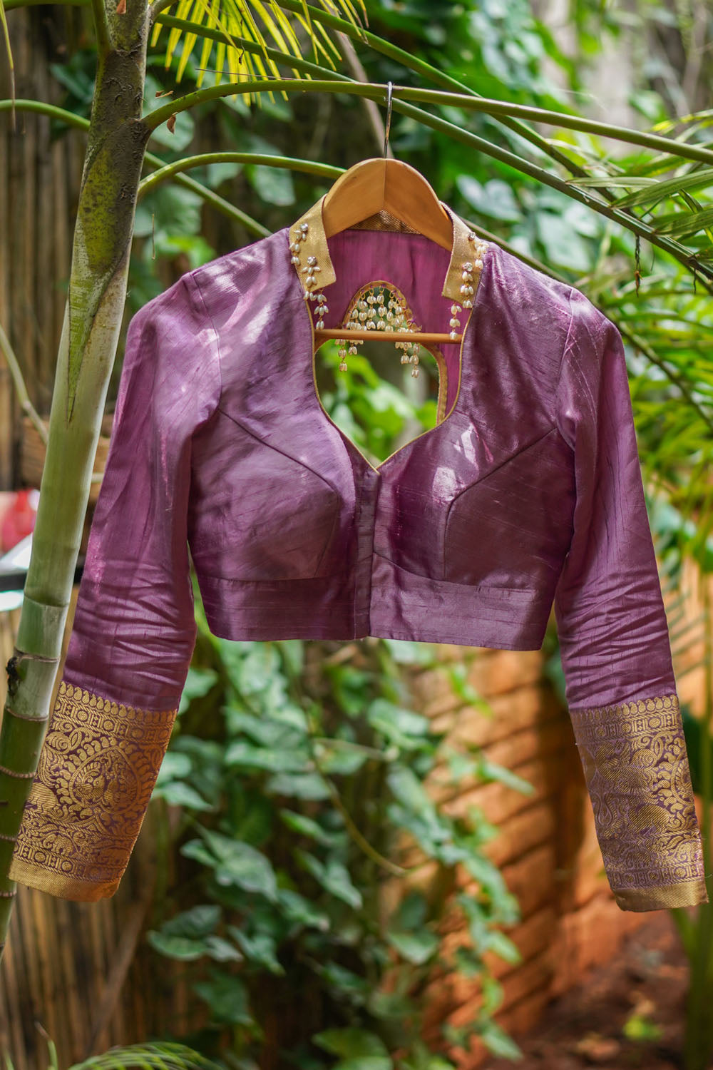Dusty mauve raw silk chinese collar sweetheart neck blouse with beads detailing.