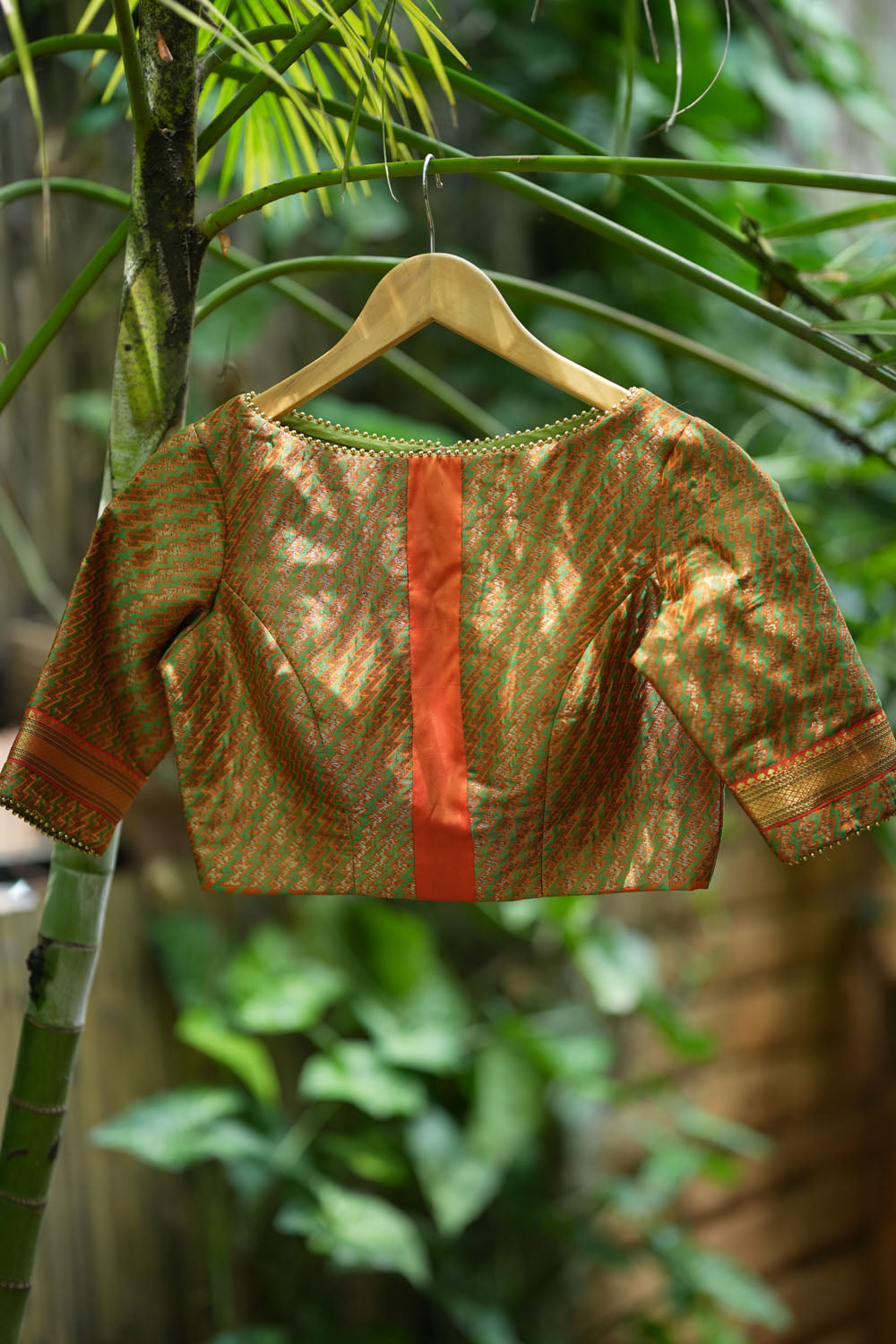 Green jacquard orange brocade boatneck blouse with plain silk detailing