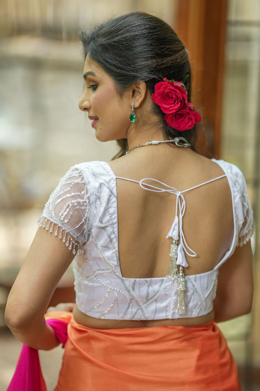 White sequin sweetheart neck blouse with  net frills detailing.