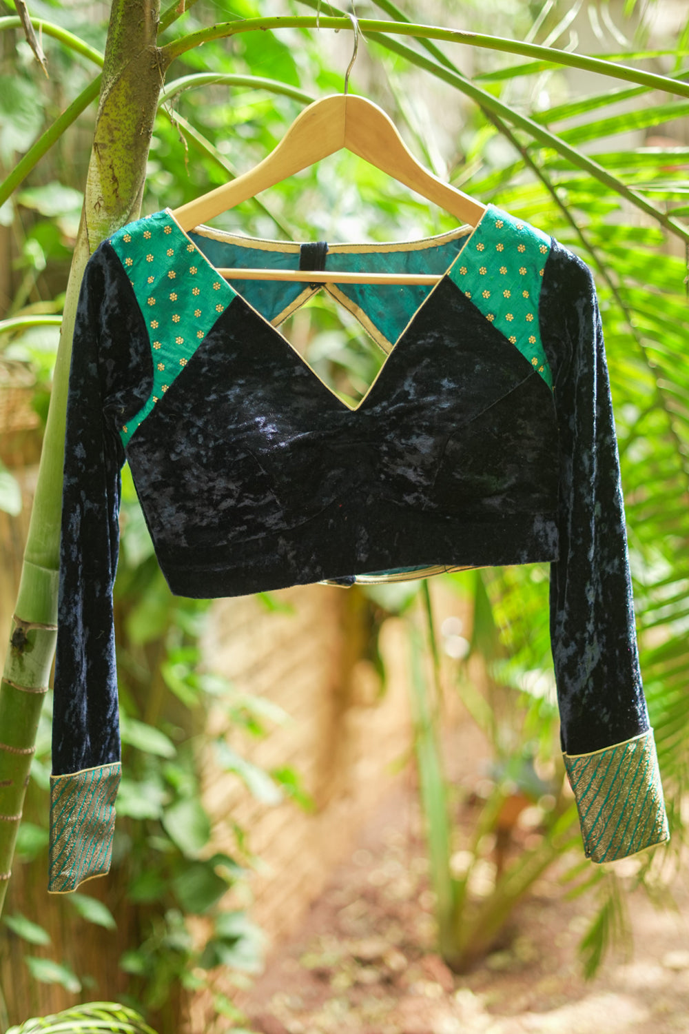Navy blue crushed velvet V neck blouse with raw silk and brocade detailing