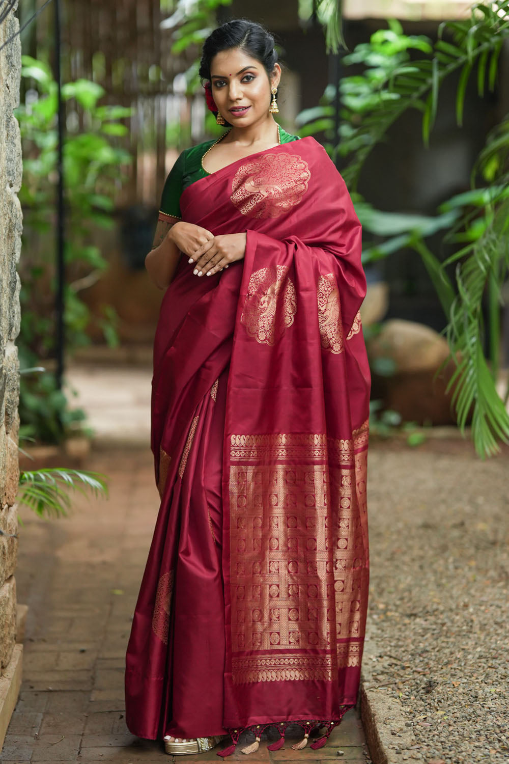 Deep red Kanjivaram saree with dacing peacock motifs