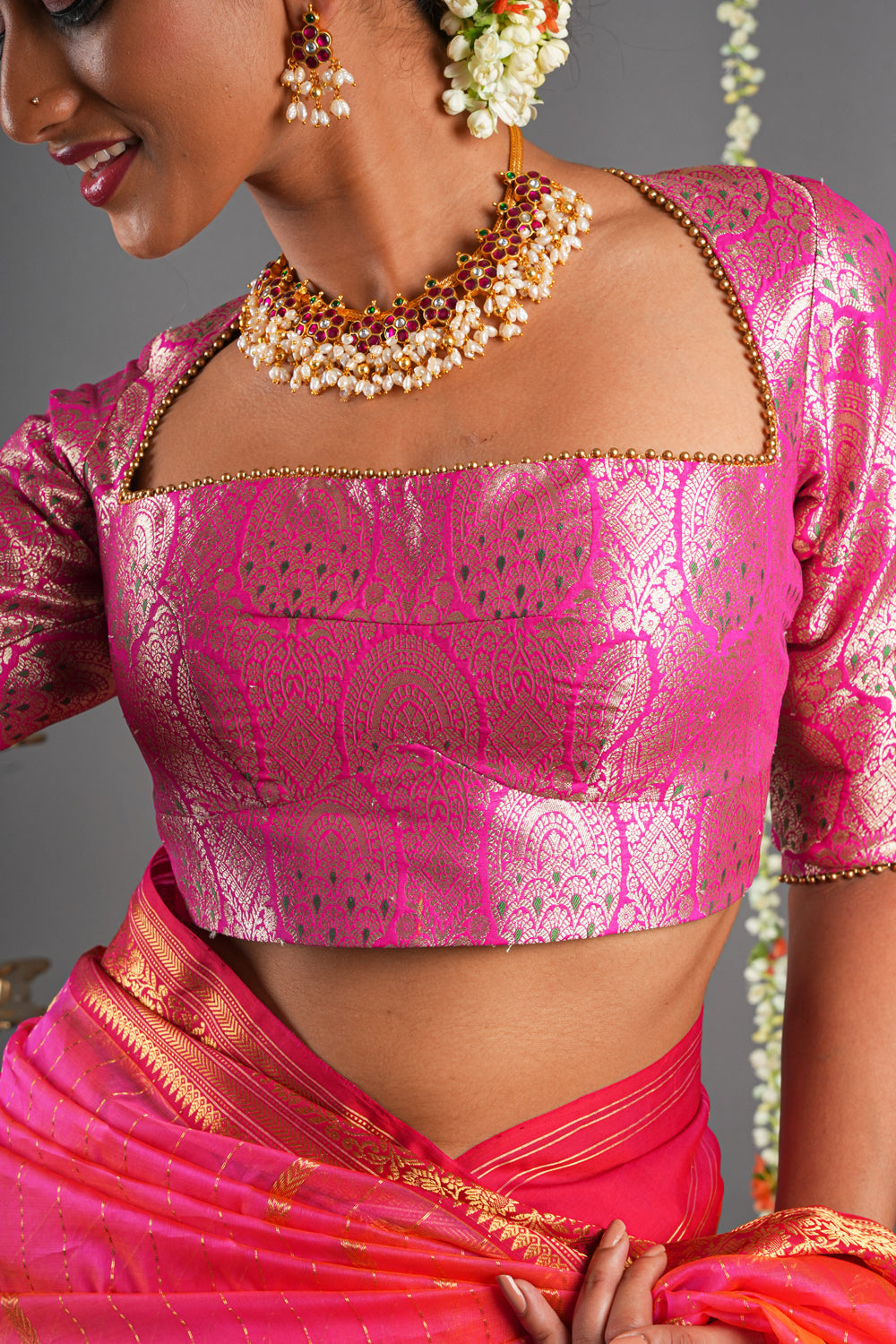 Pink brocade 3/4 th sleeves blouse with trapezoid neck and beads detailing