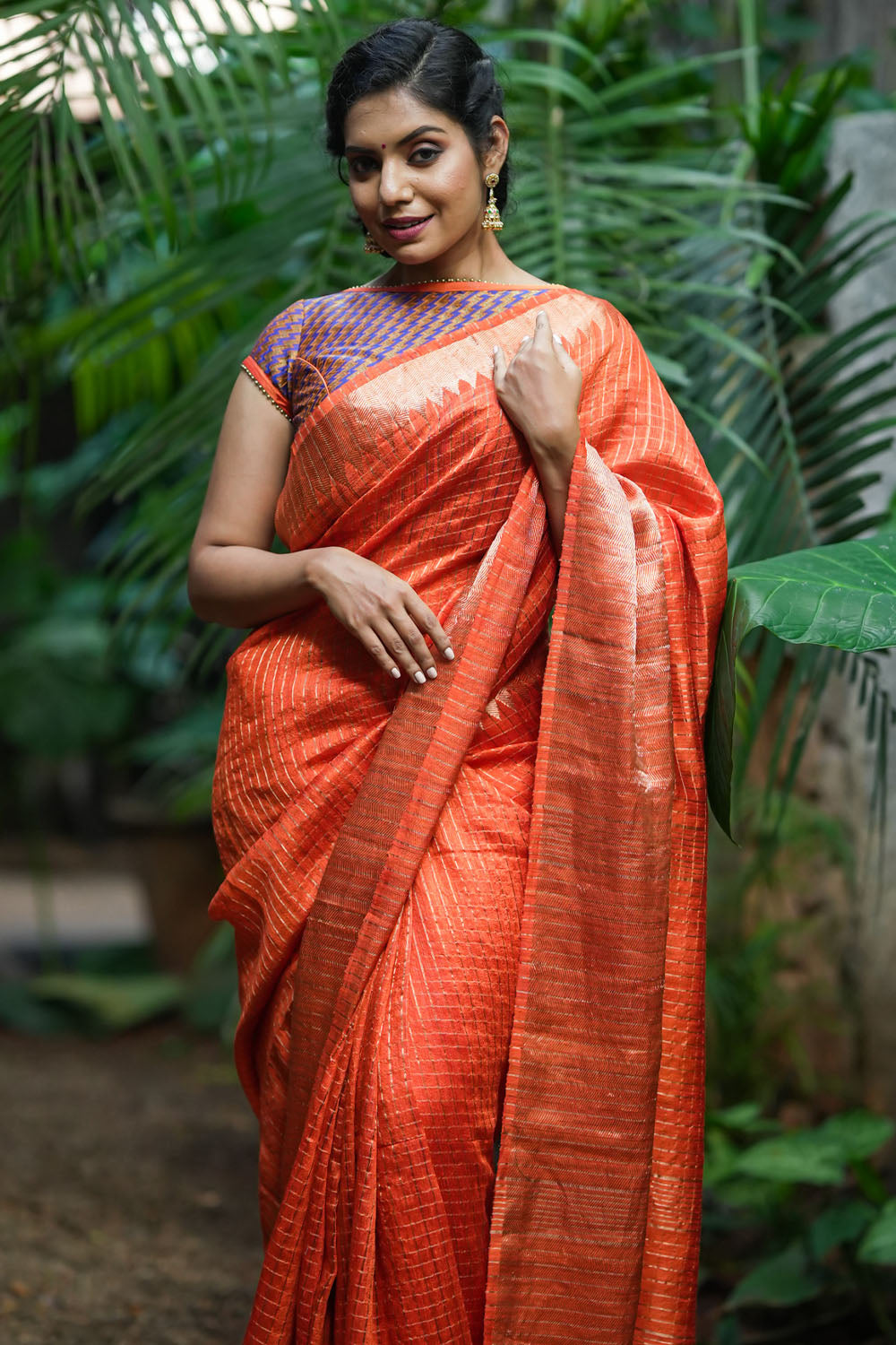 Orange matka silk with zari checks and wide zari temple border Saree