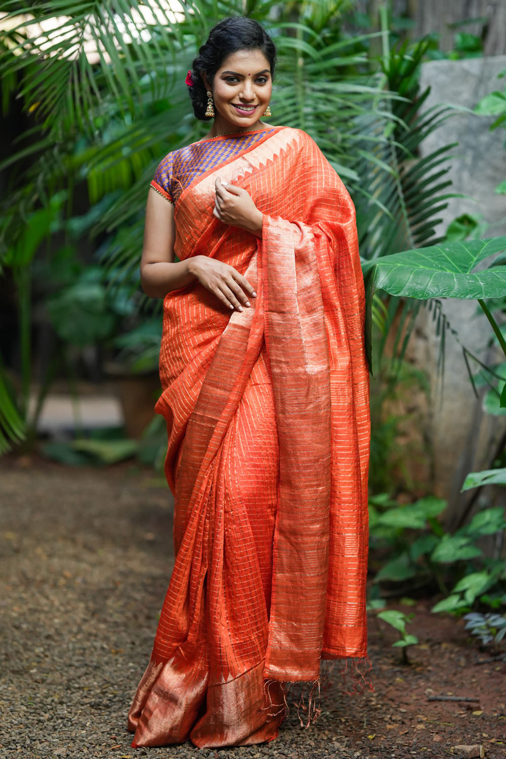 Orange matka silk with zari checks and wide zari temple border Saree