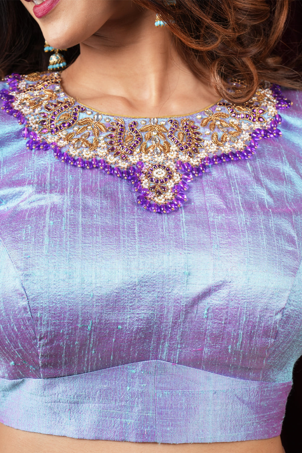 Periwinkle pure raw silk close neck blouse with intricate hand embroidery on sleeves and neck.