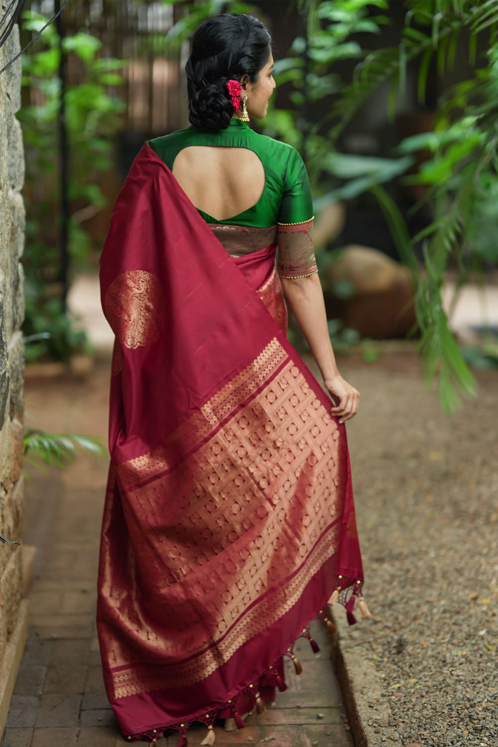 Deep red Kanjivaram saree with dacing peacock motifs