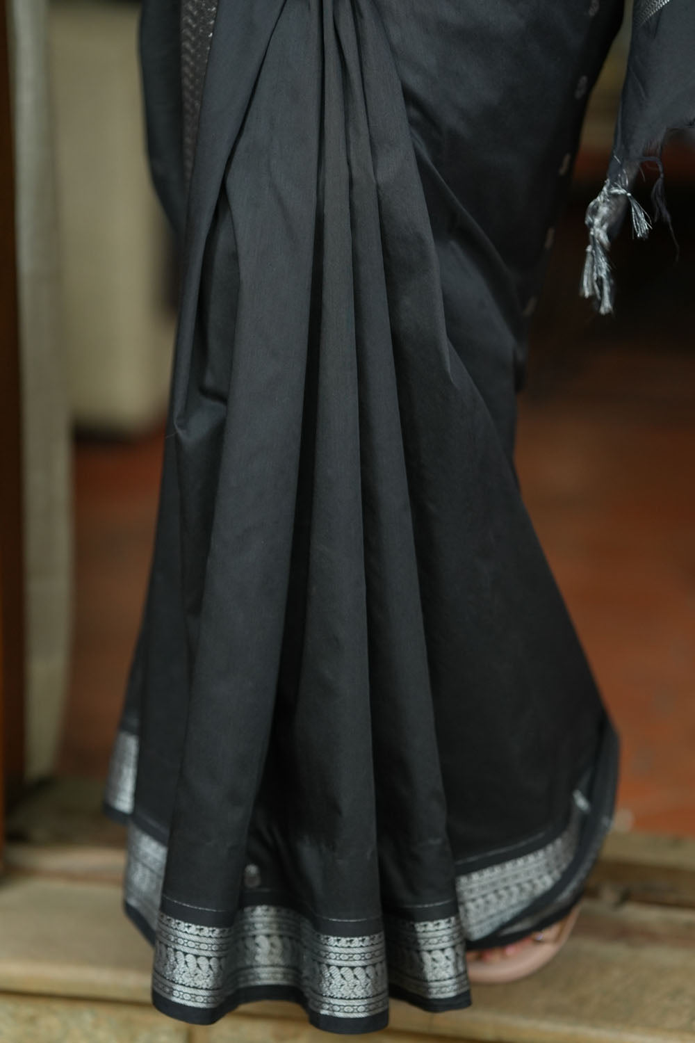 Black cotton silk with silver zari borders and buttas saree