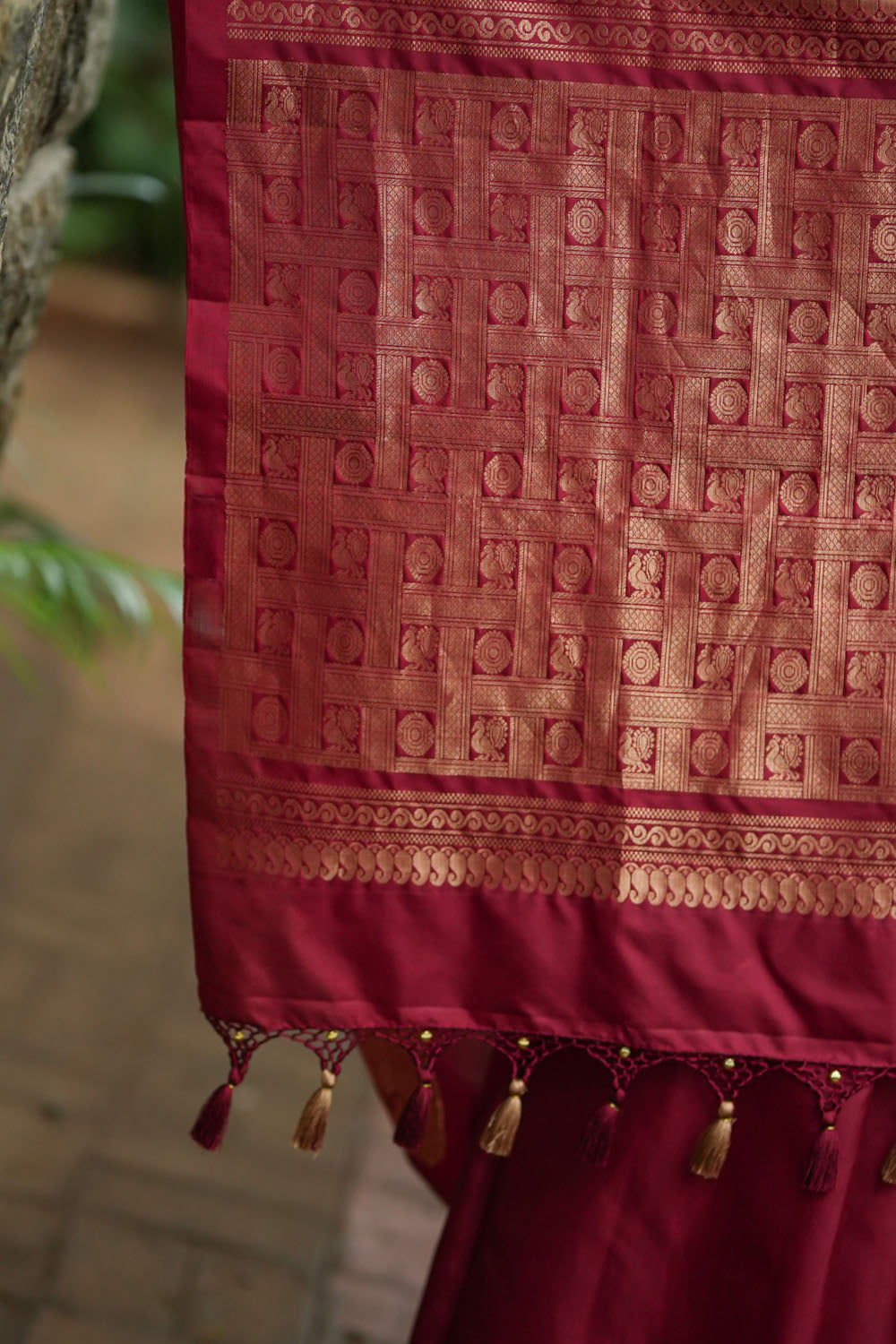 Deep red Kanjivaram saree with dacing peacock motifs