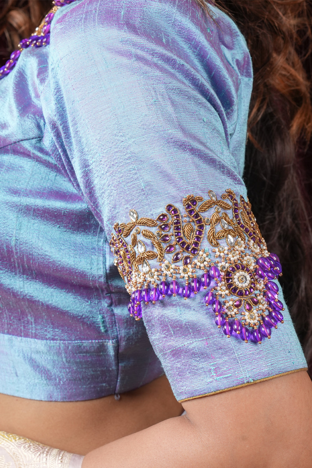 Periwinkle pure raw silk close neck blouse with intricate hand embroidery on sleeves and neck.