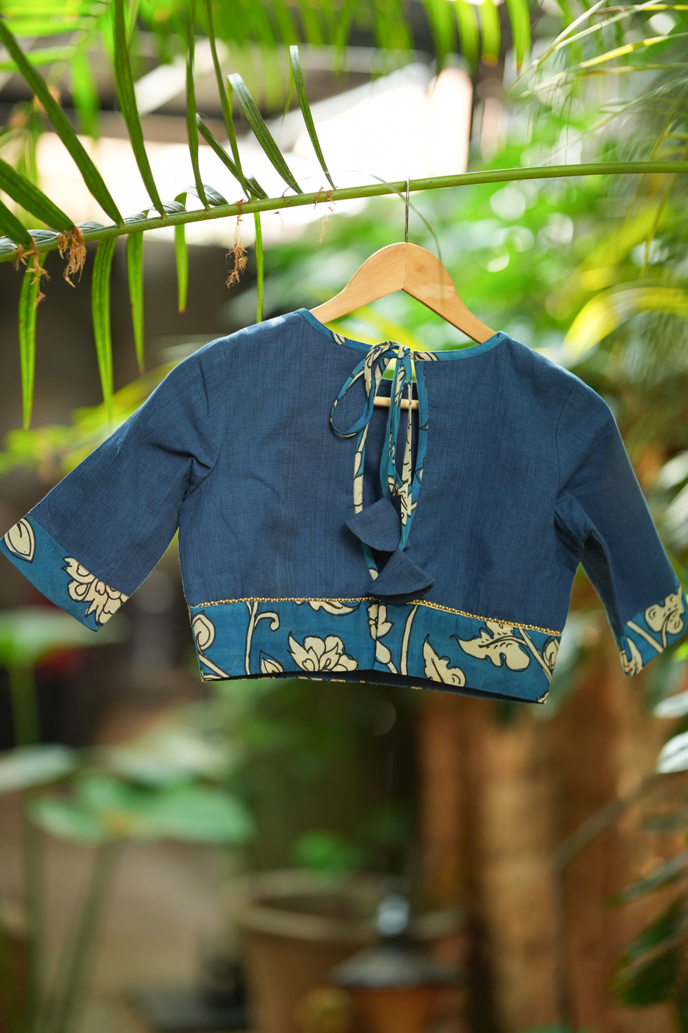 Saphire blue closed neck handloom blouse with handpainted kalamkari border.