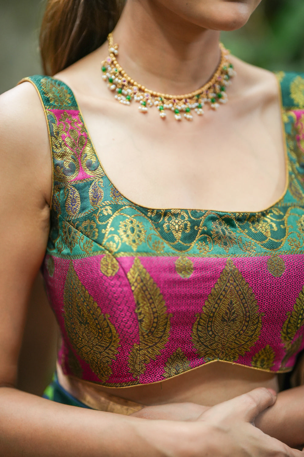 Green and pink banarasi brocade U neck sleeveless blouse.