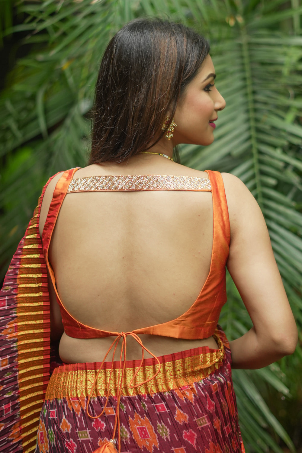 Orange silk sweetheart neck blouse with border detailing