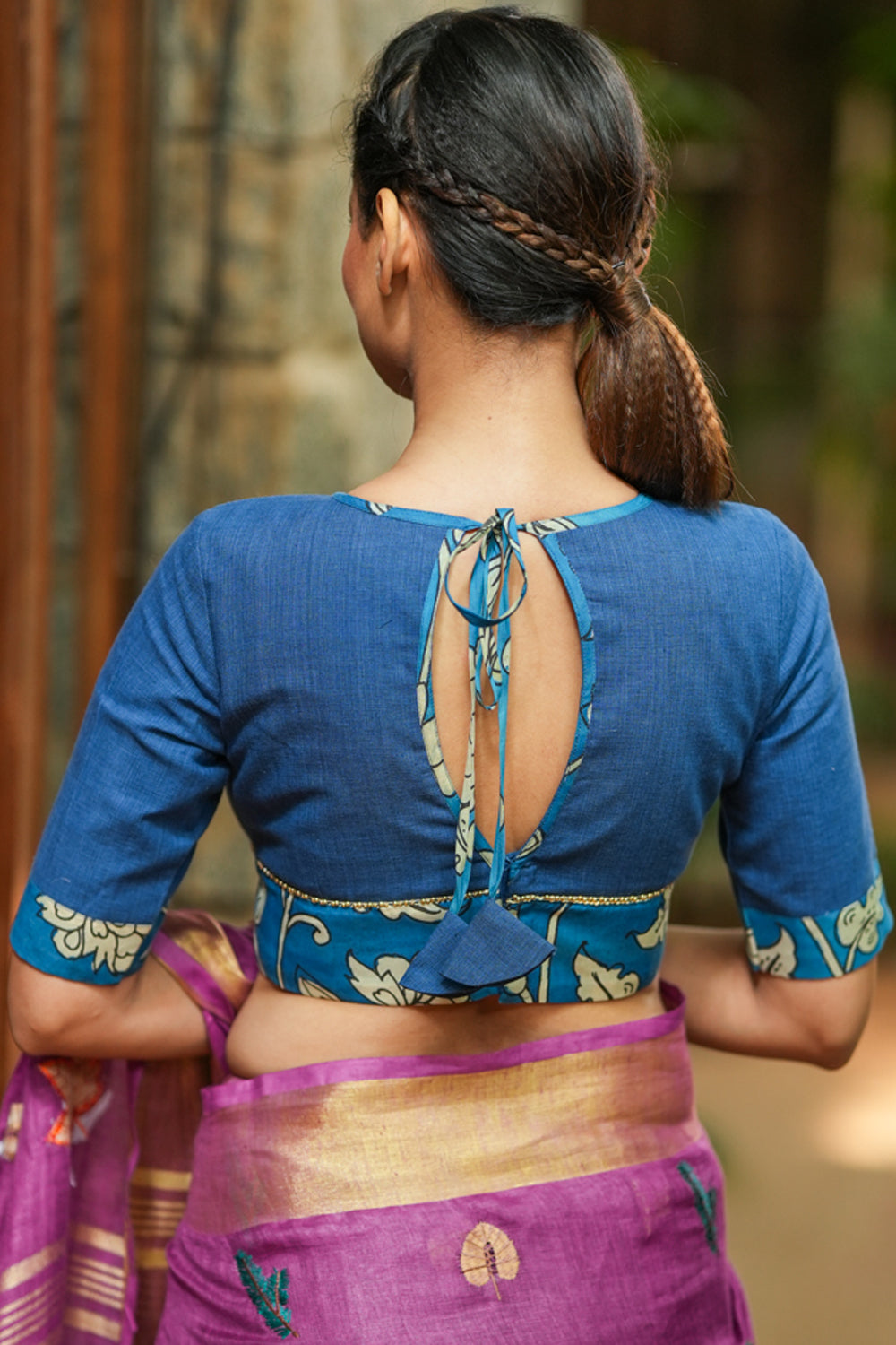 Saphire blue closed neck handloom blouse with handpainted kalamkari border.
