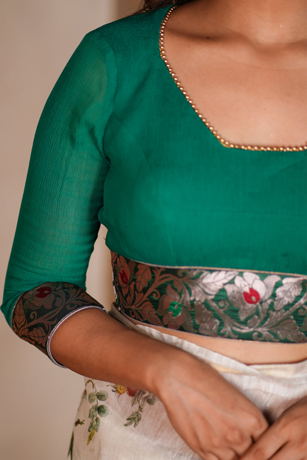 Green chiffon blouse with brocade detailing and sheer sleeves