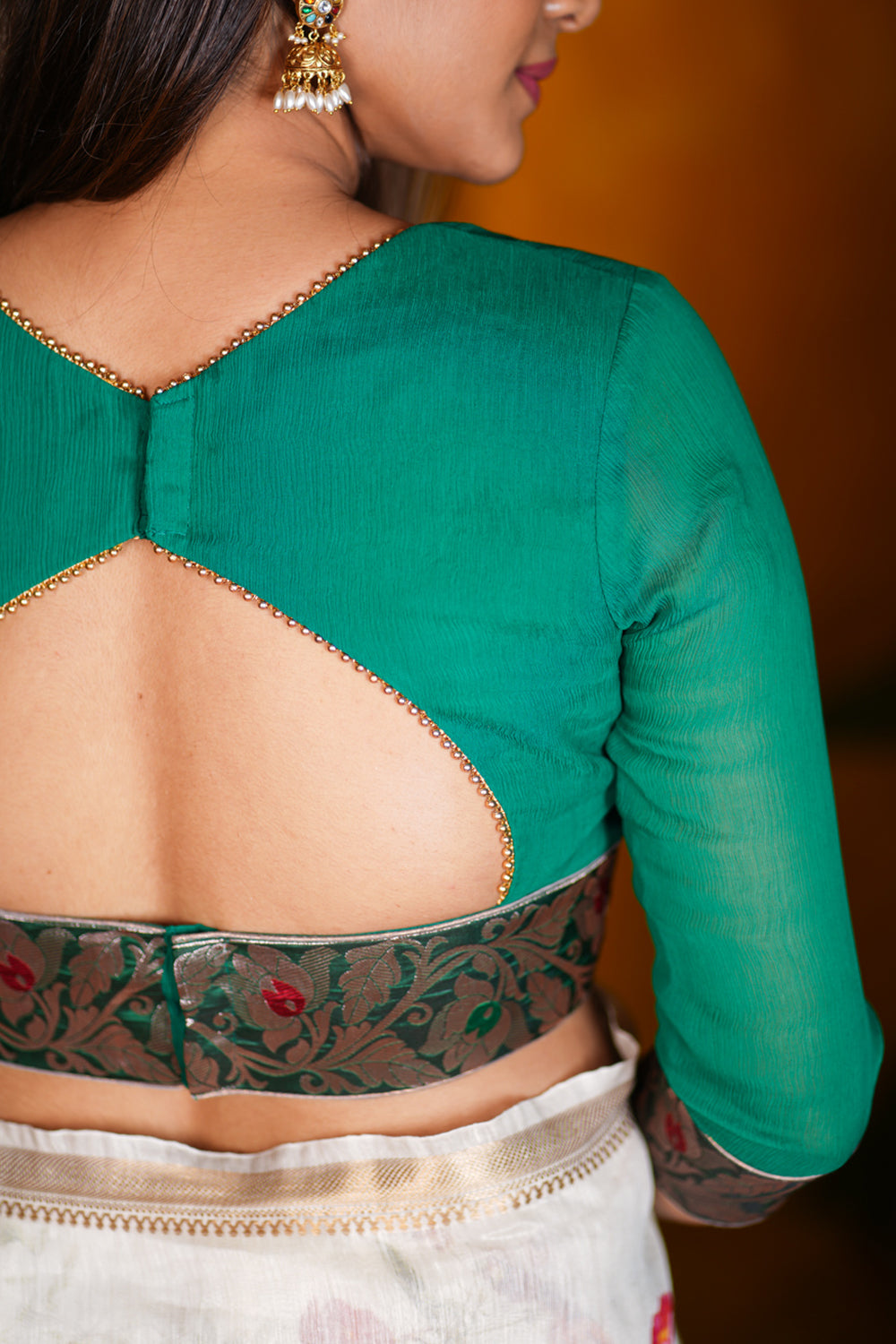 Green chiffon blouse with brocade detailing and sheer sleeves