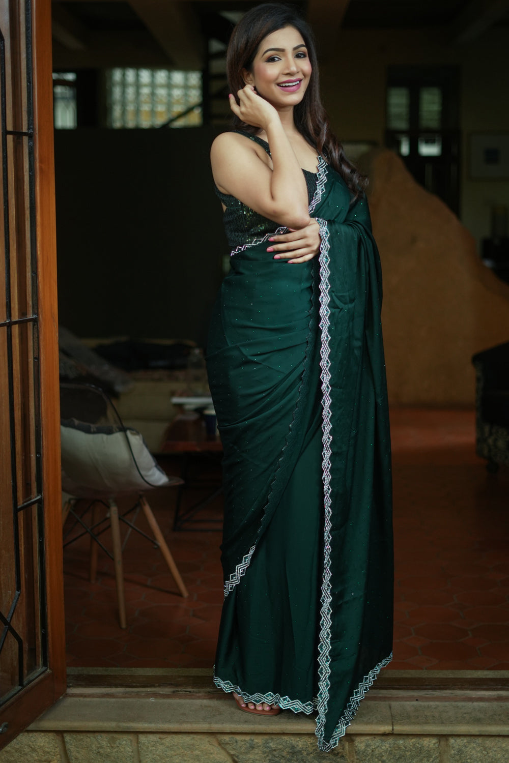 Bottle green soft satin saree with stone work border