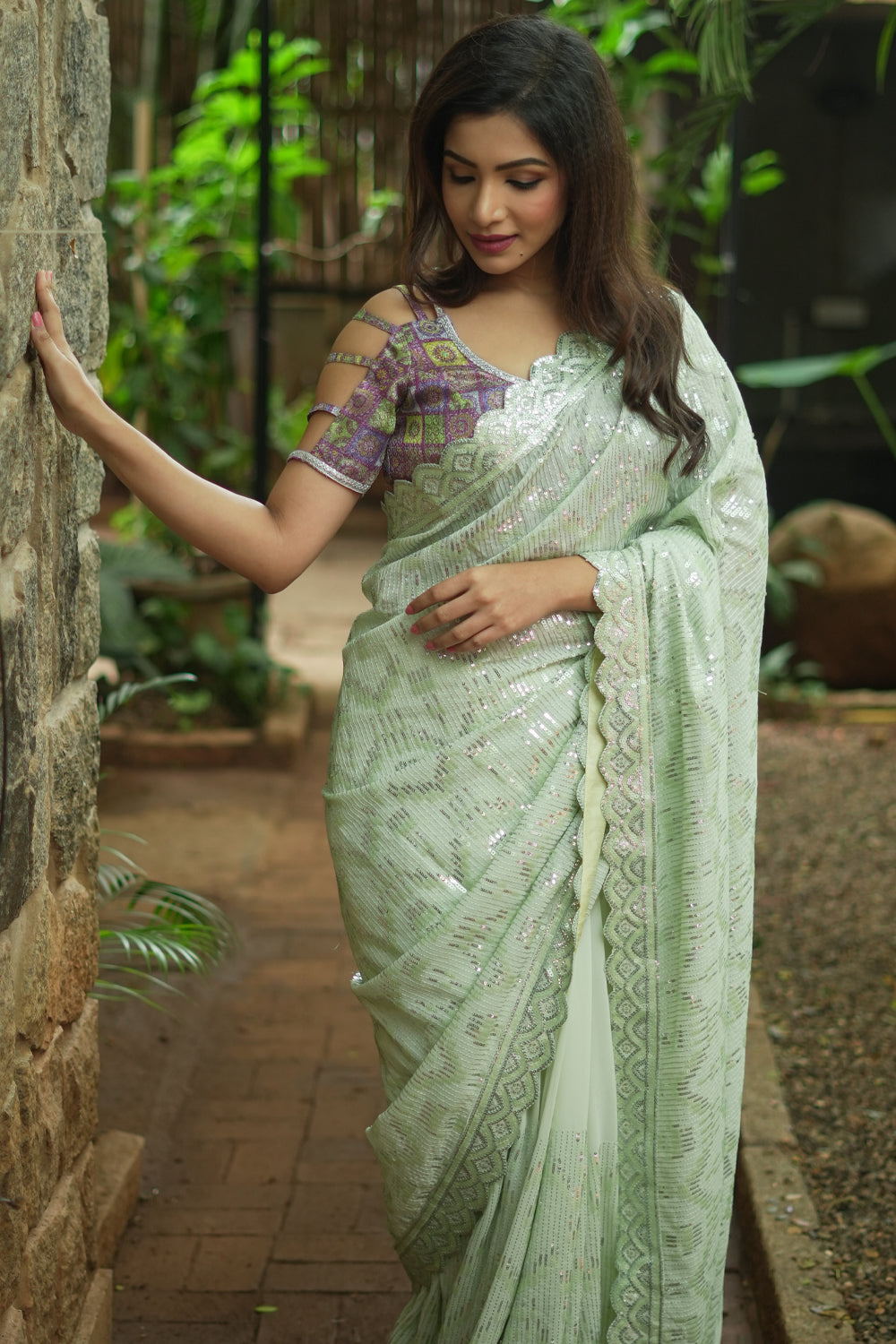 Pista green georgette sequin saree with scalloped edging