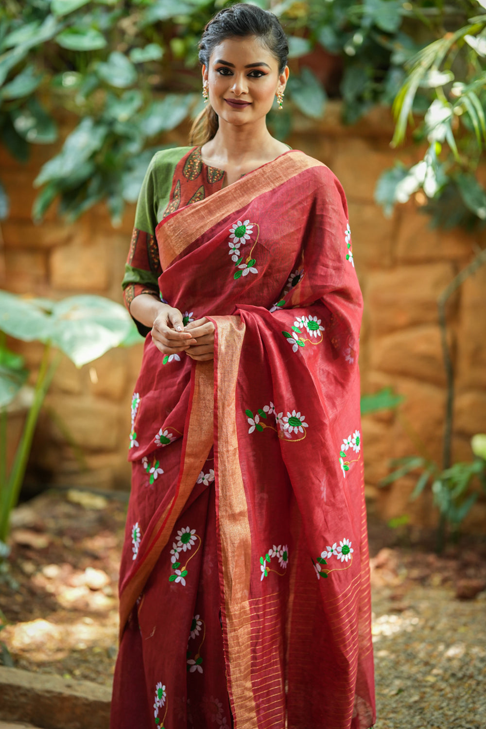 Brick red embroidered linen saree
