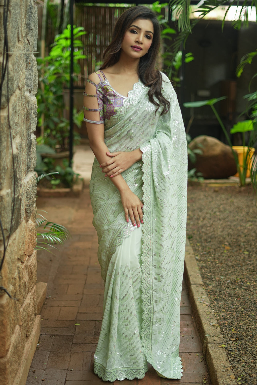Pista green georgette sequin saree with scalloped edging