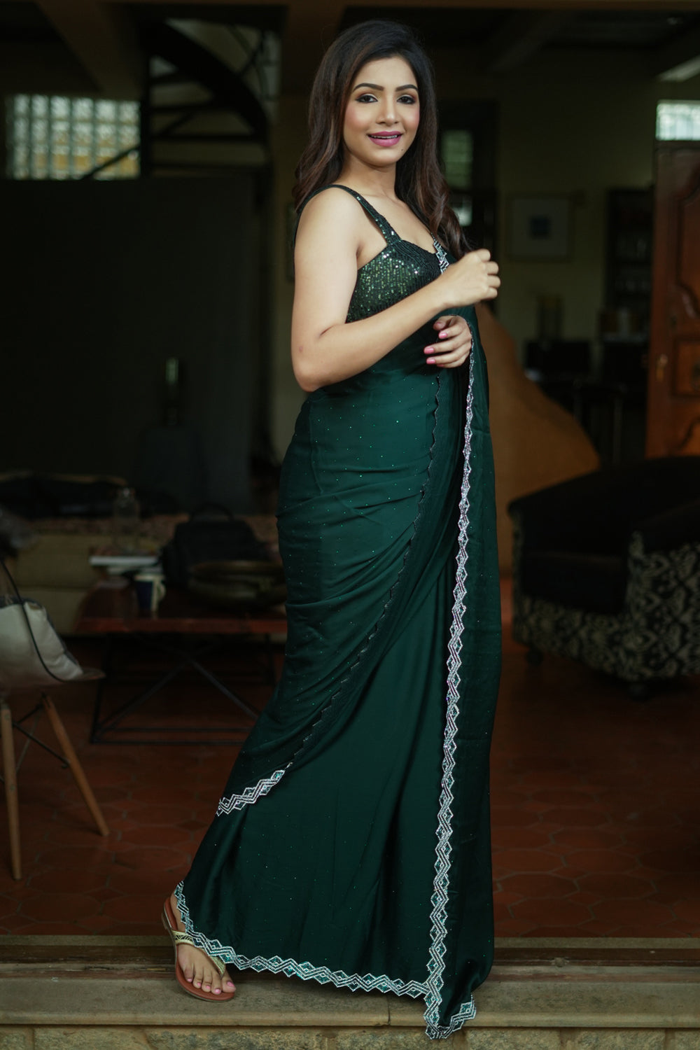 Bottle green soft satin saree with stone work border