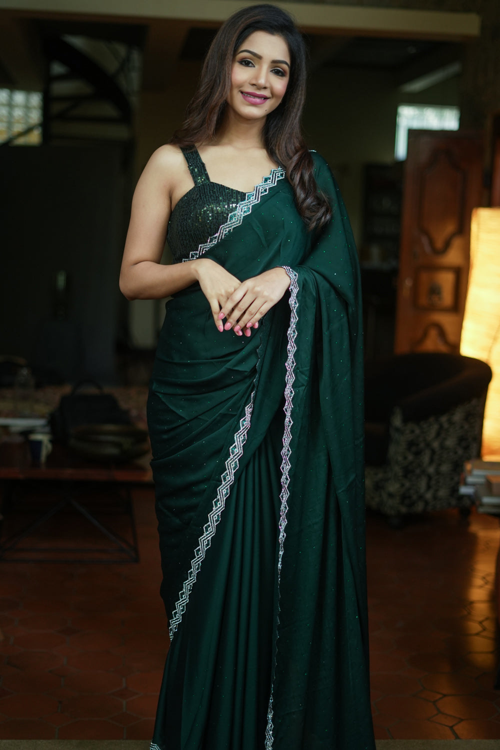 Bottle green soft satin saree with stone work border