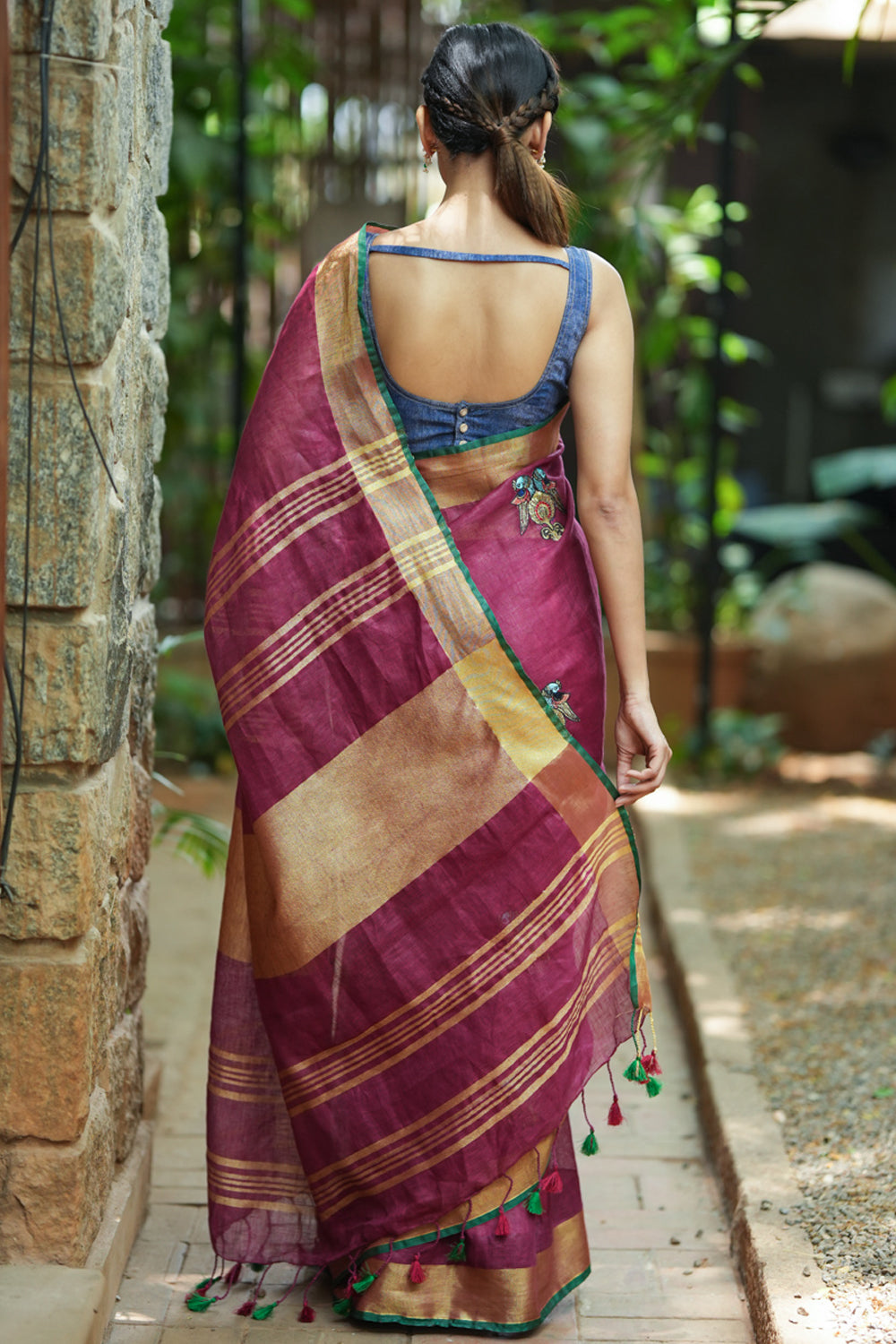 Dark purple linen saree with embroidered parrots motifs