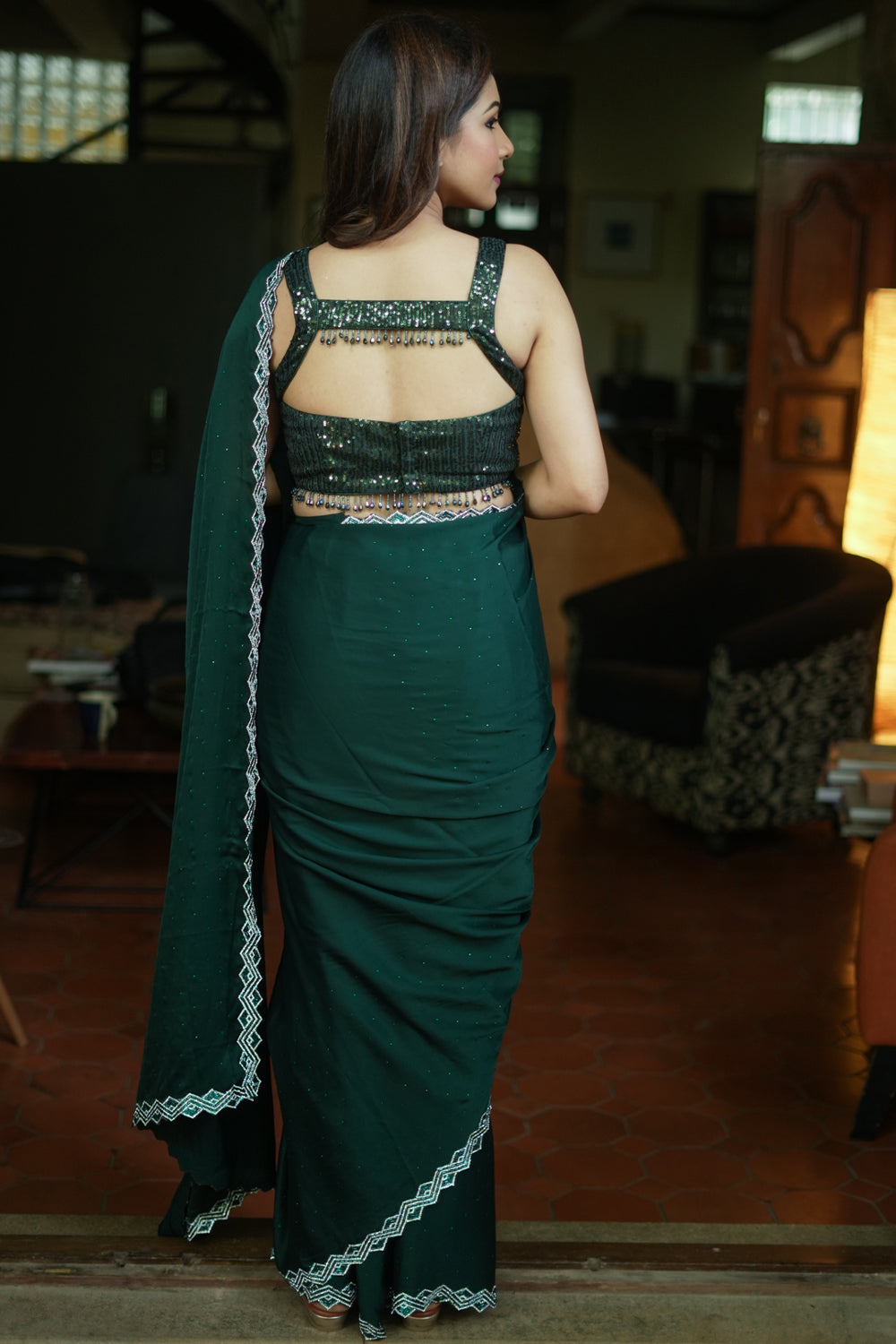 Bottle green soft satin saree with stone work border