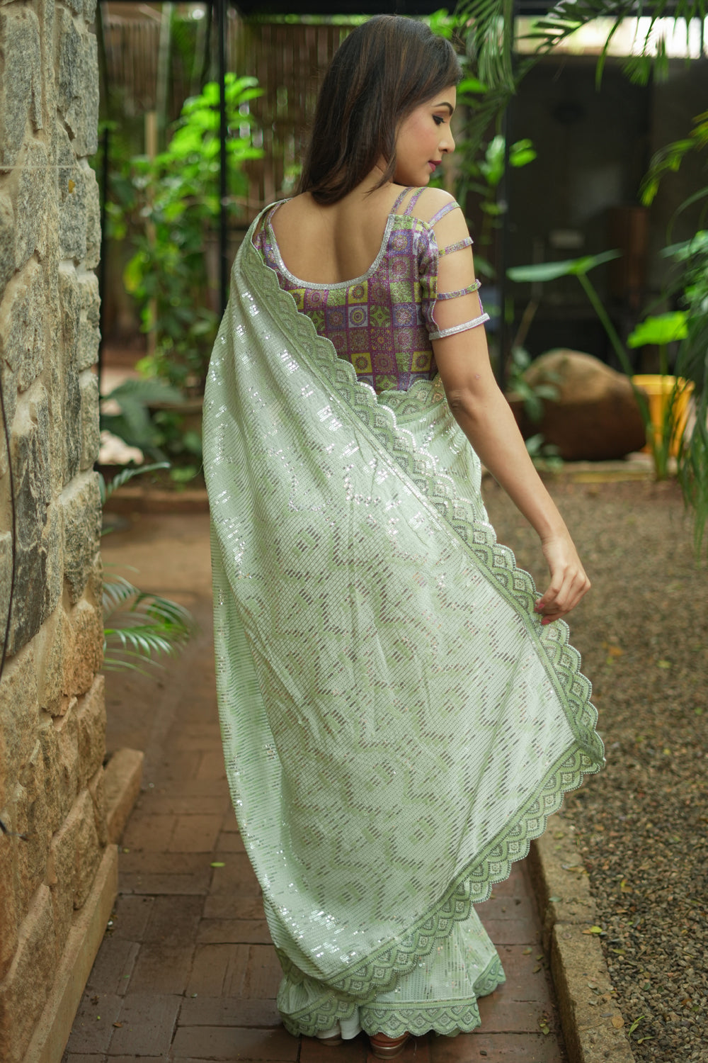 Pista green georgette sequin saree with scalloped edging