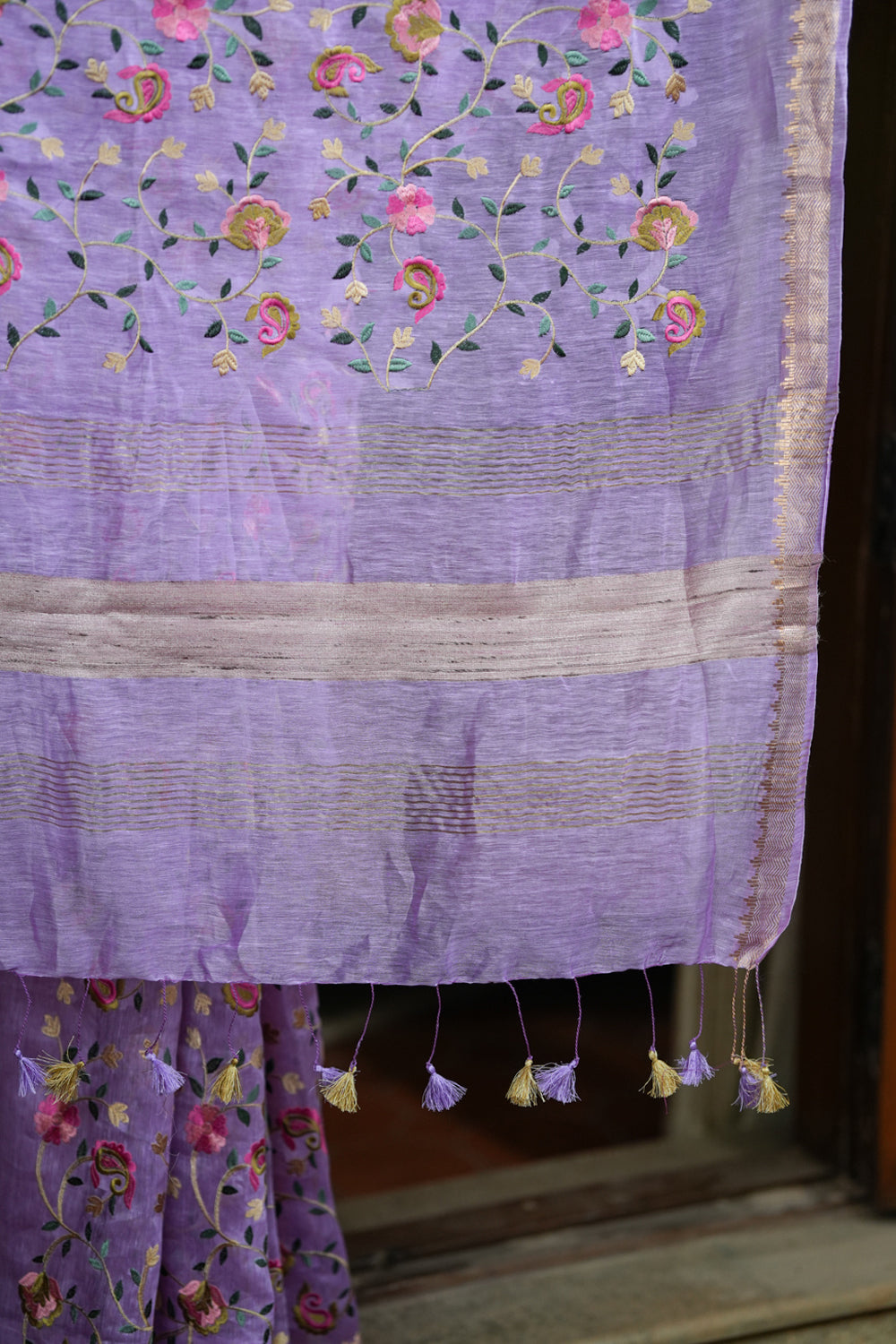 Lilac floral linen saree with woven zari borders