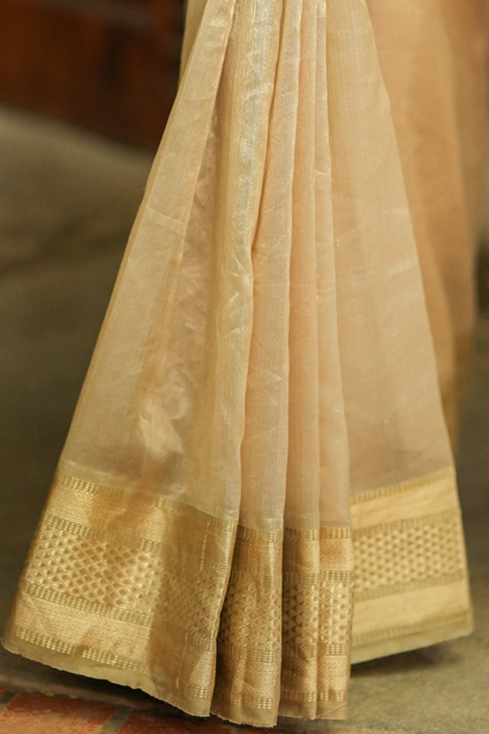 Handwoven maheshwari tissue saree with gold zari border