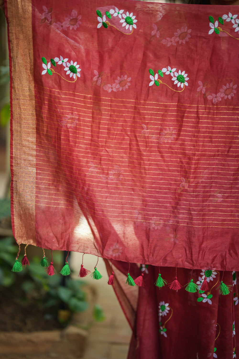 Brick red embroidered linen saree