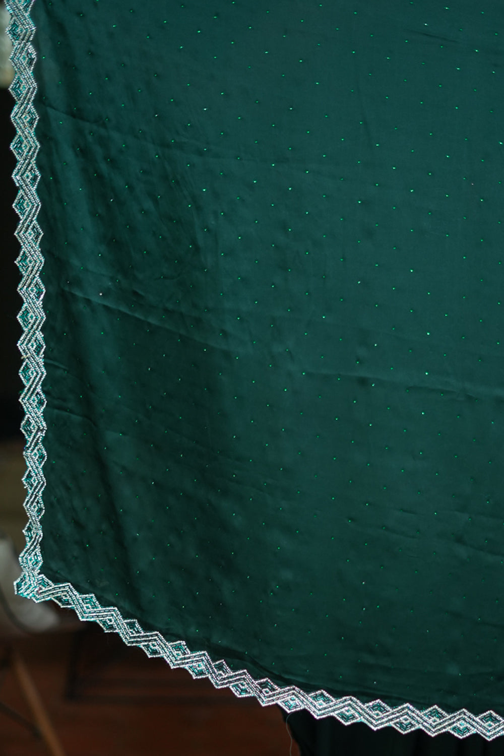 Bottle green soft satin saree with stone work border