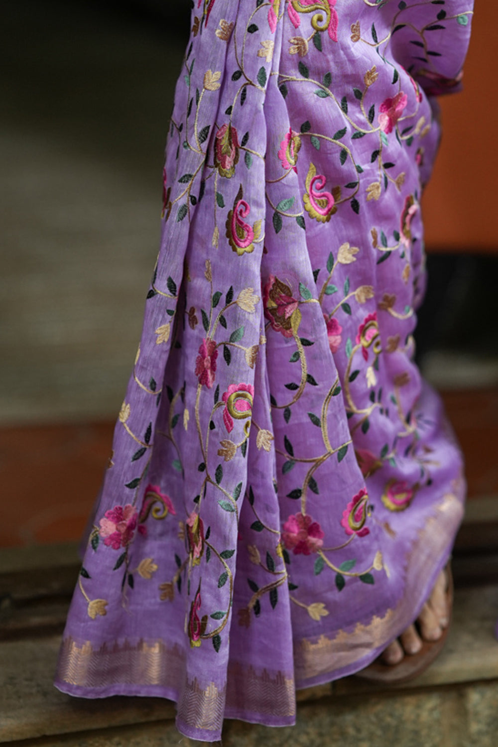 Lilac floral linen saree with woven zari borders