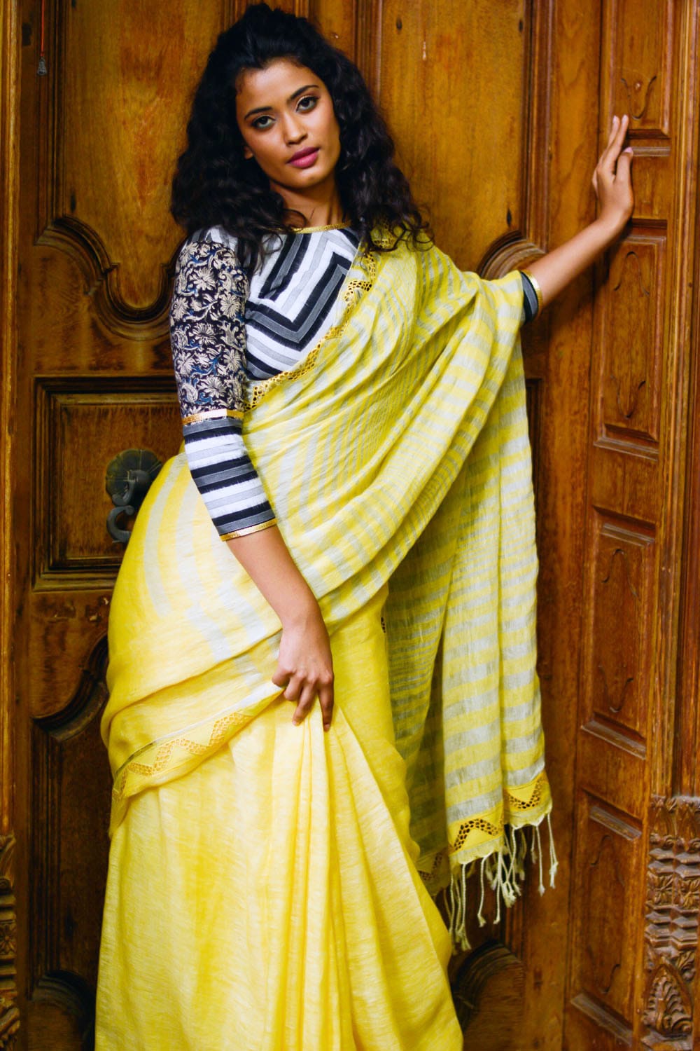 Lemon yellow handwoven linen silver stripes saree with cutwork border and cutwork pallu