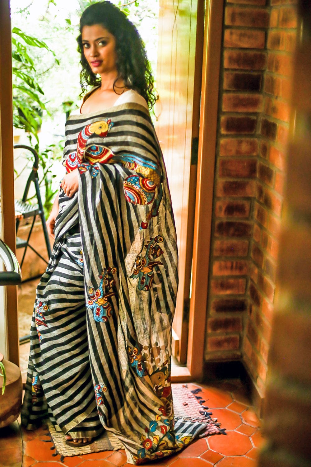 Black and white striped handwoven linen saree with silver tissue border with kalamkari applique