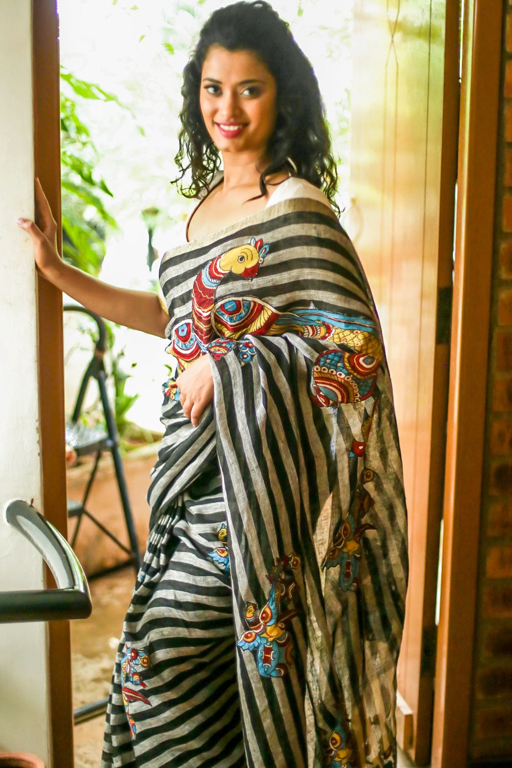 Black and white striped handwoven linen saree with silver tissue border with kalamkari applique