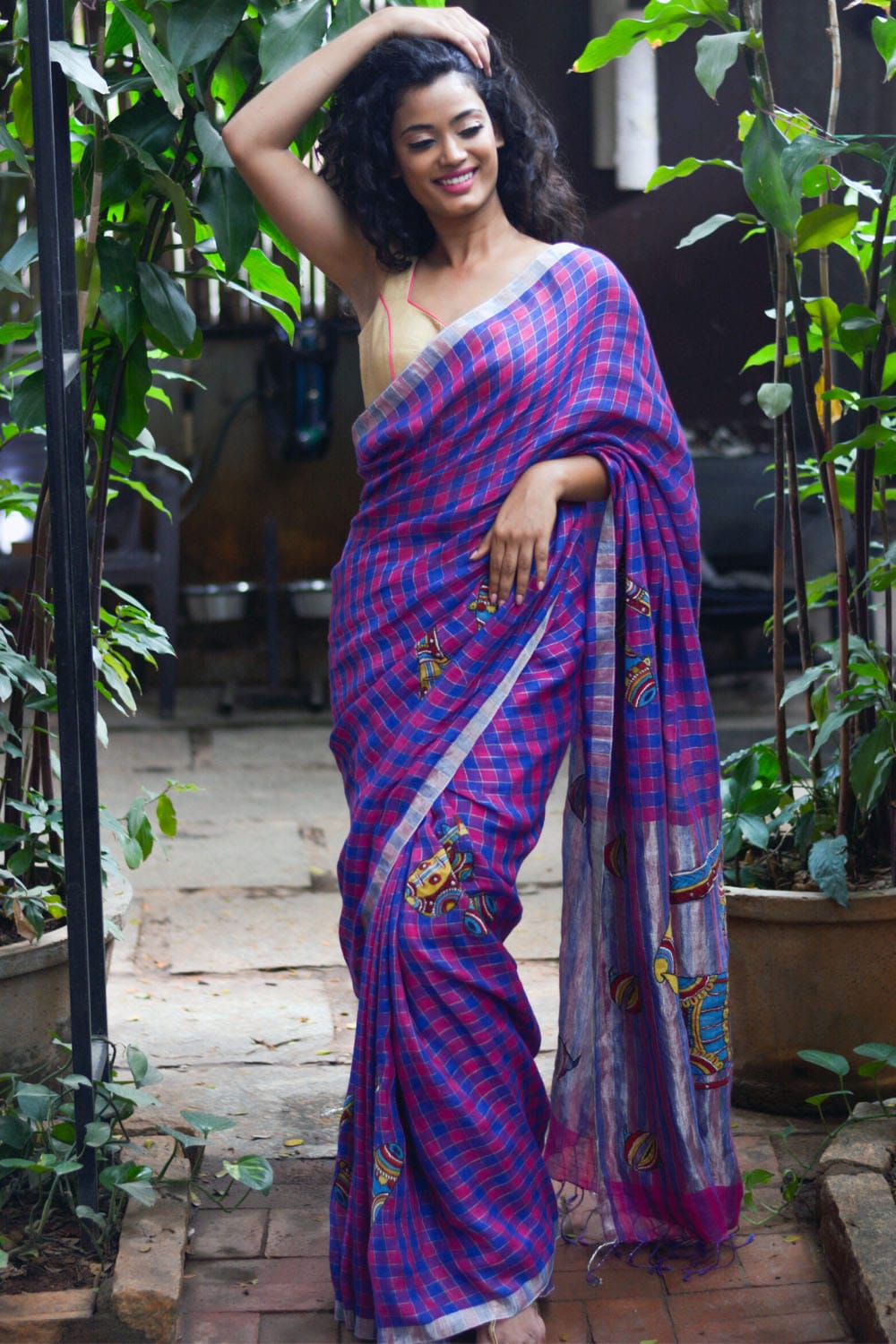 Pink blue checked handwoven linen saree with musical instruments kalamkari applique