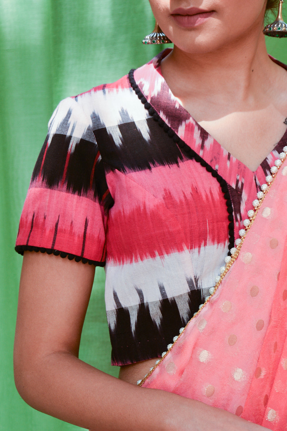 Pink, black and white Ikat cotton V neck blouse with black pom pom detailing - House of Blouse