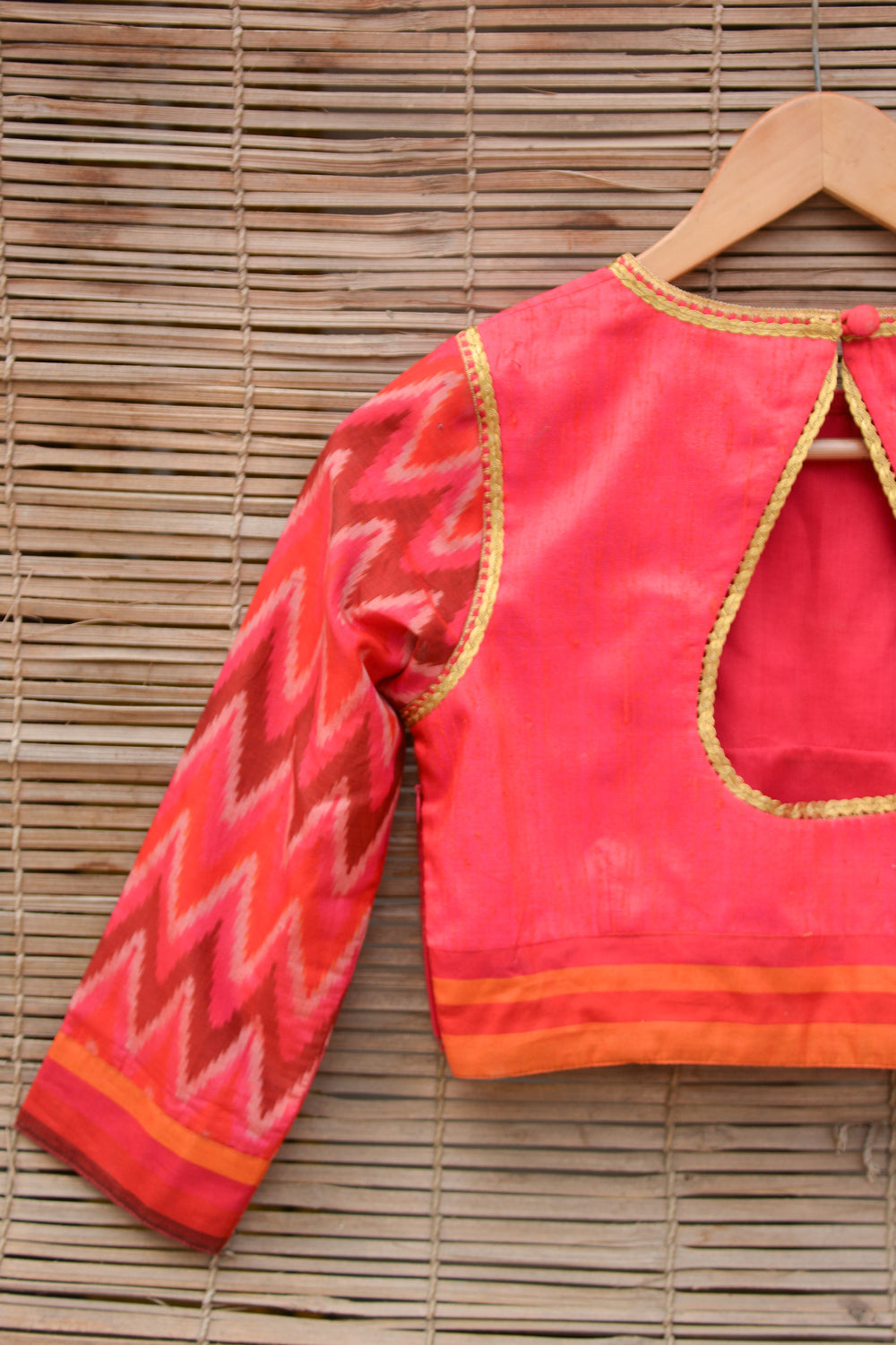 Reddish pink raw silk closed neck blouse with Ikat sleeves - House of Blouse