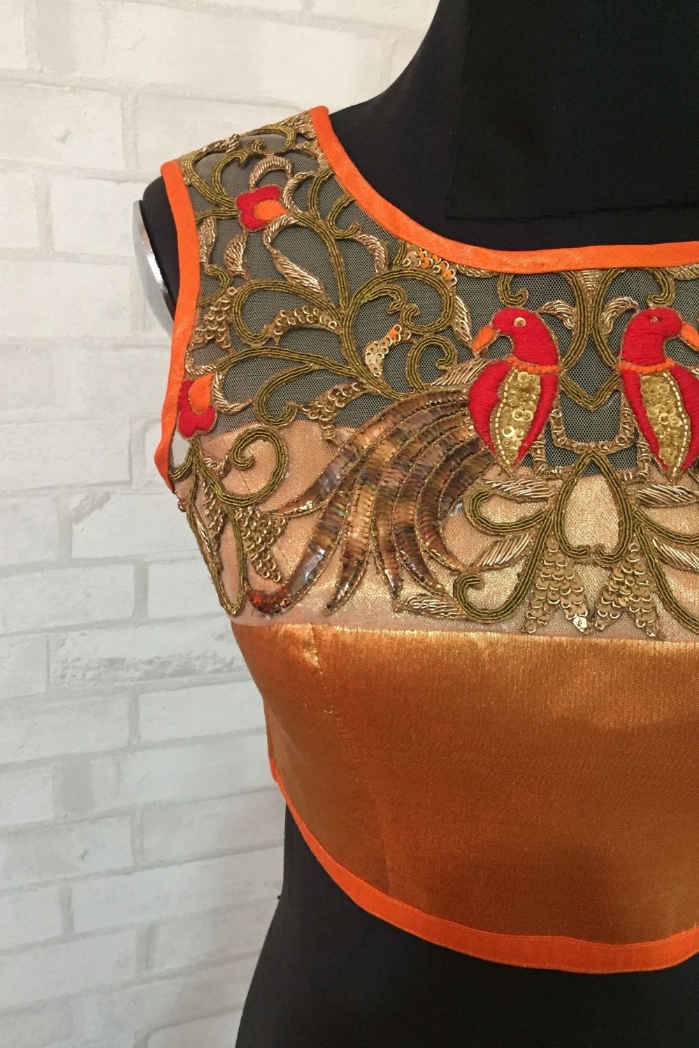 Orange tissue sleeveless blouse with embellished yoke and tie back - House of Blouse