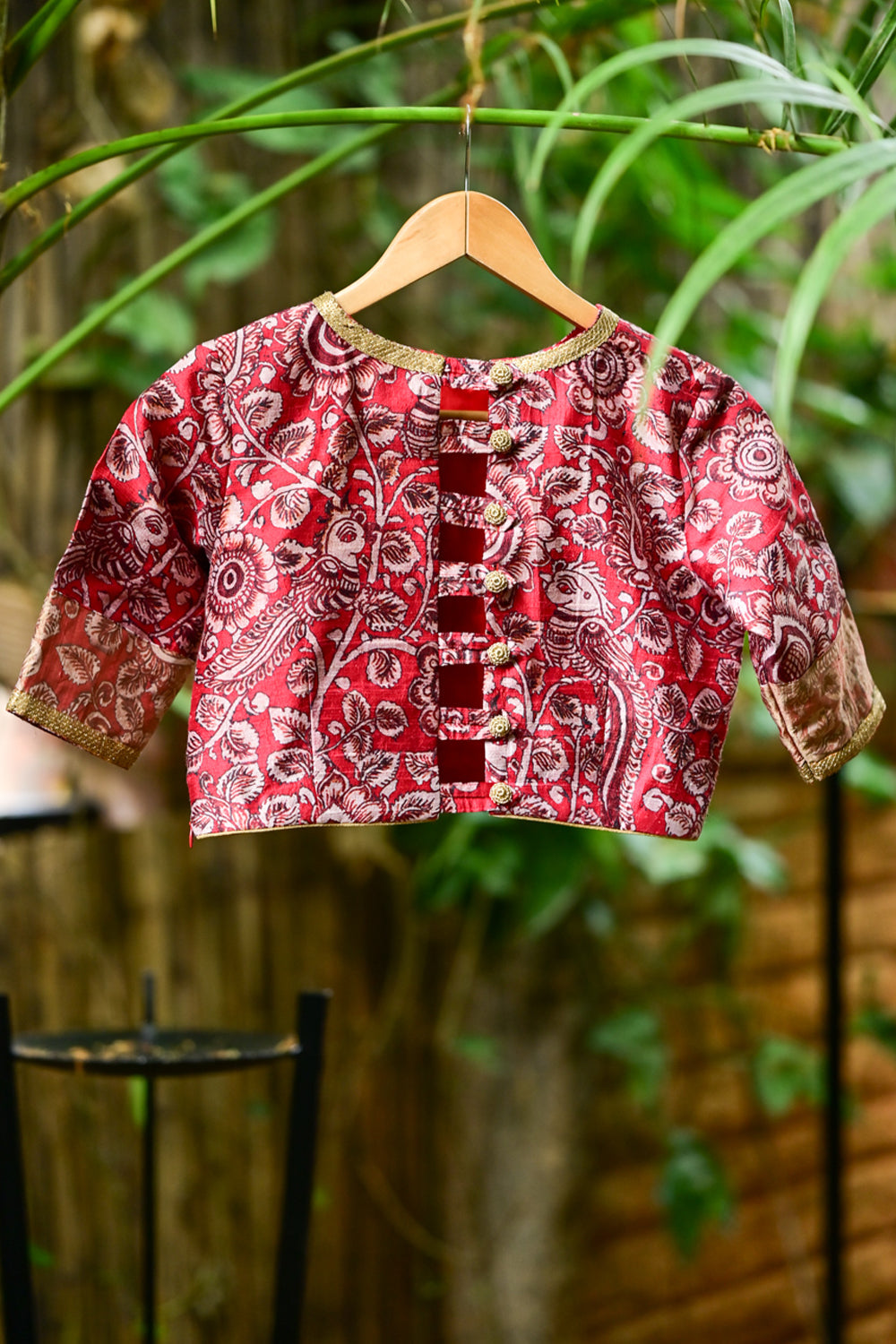 Red floral pure raw silk closed neck  blouse with zari border.