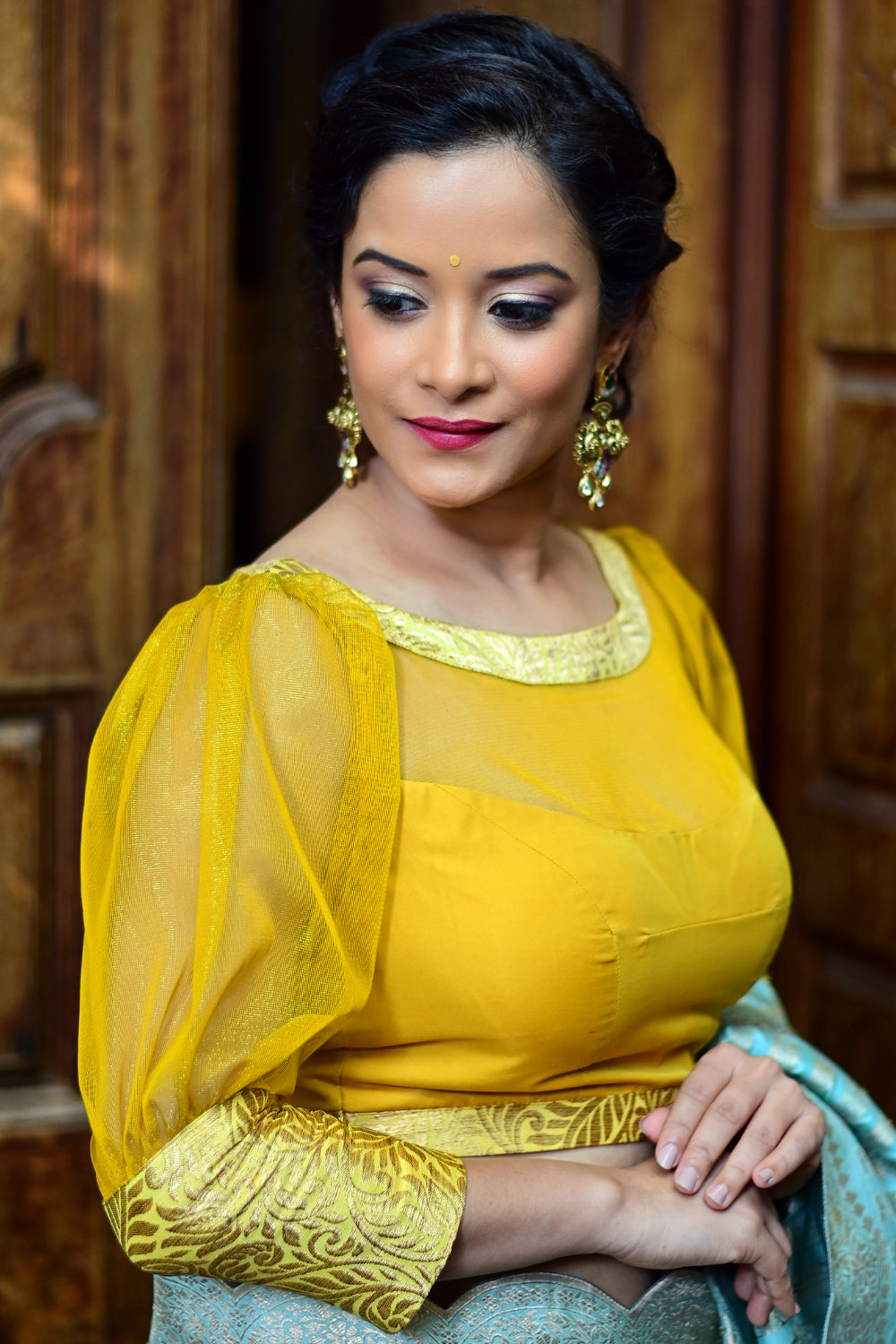 Yellowish mustard silk boat neck blouse with sheer yoke