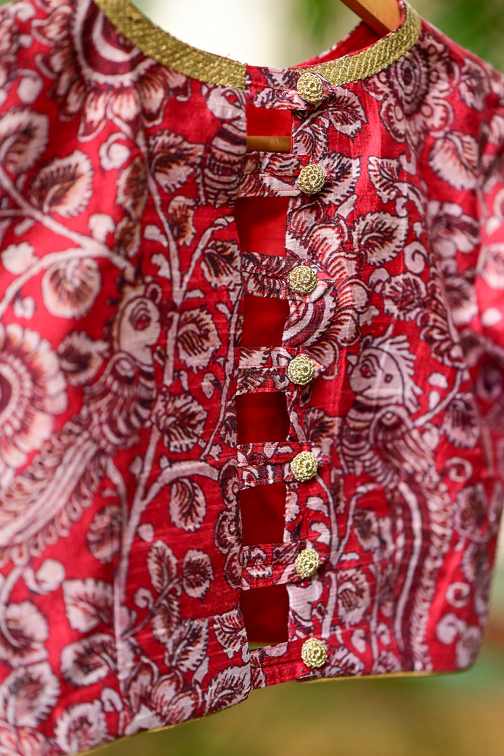 Red floral pure raw silk closed neck  blouse with zari border.