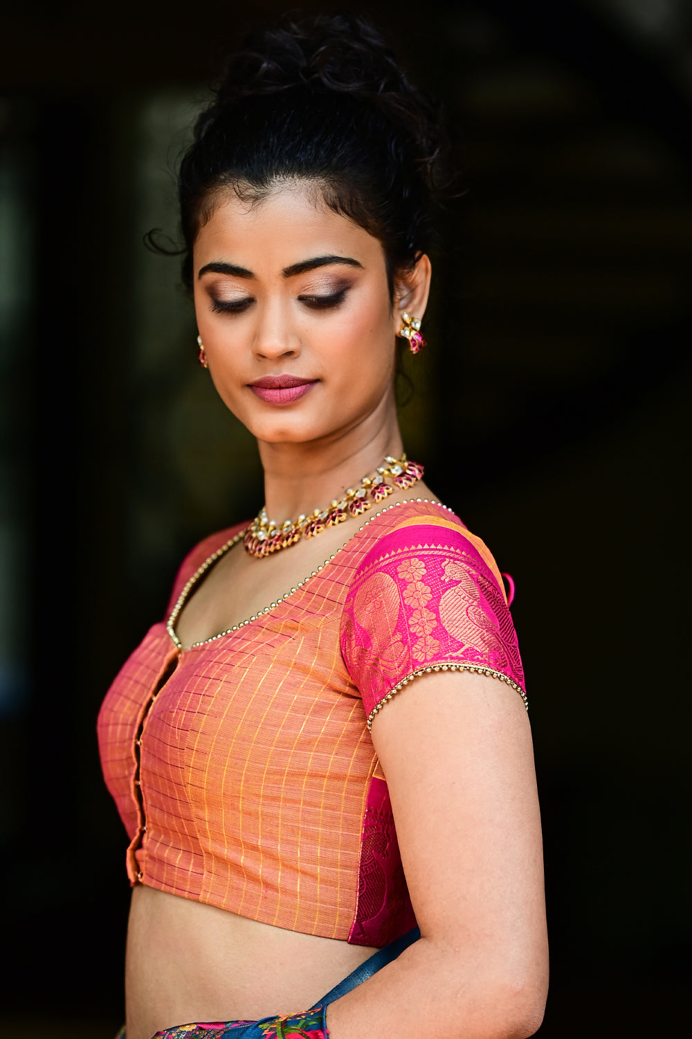 Rust orange checked U neck blouse with back detailing in Chettinad cotton