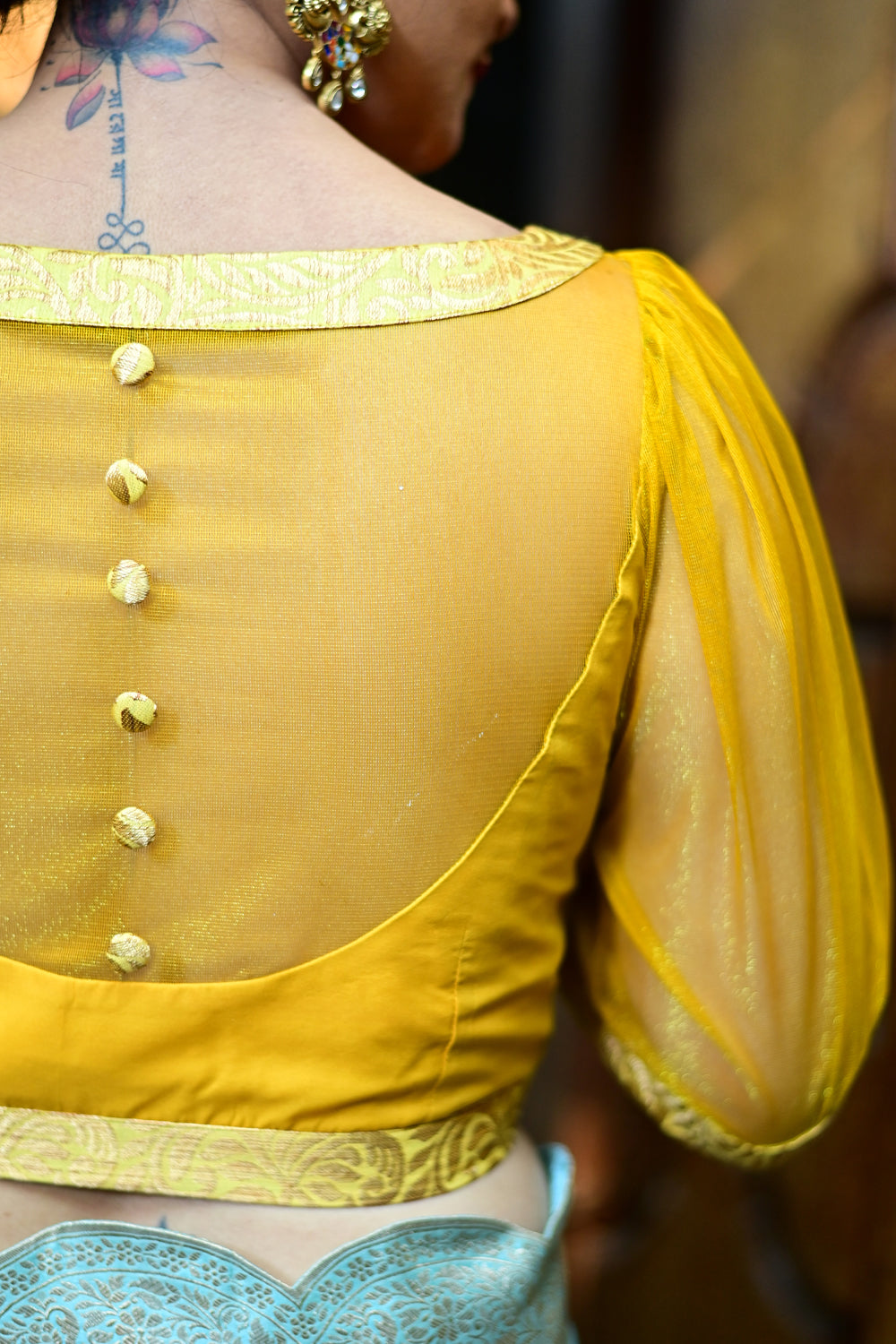 Yellowish mustard silk boat neck blouse with sheer yoke