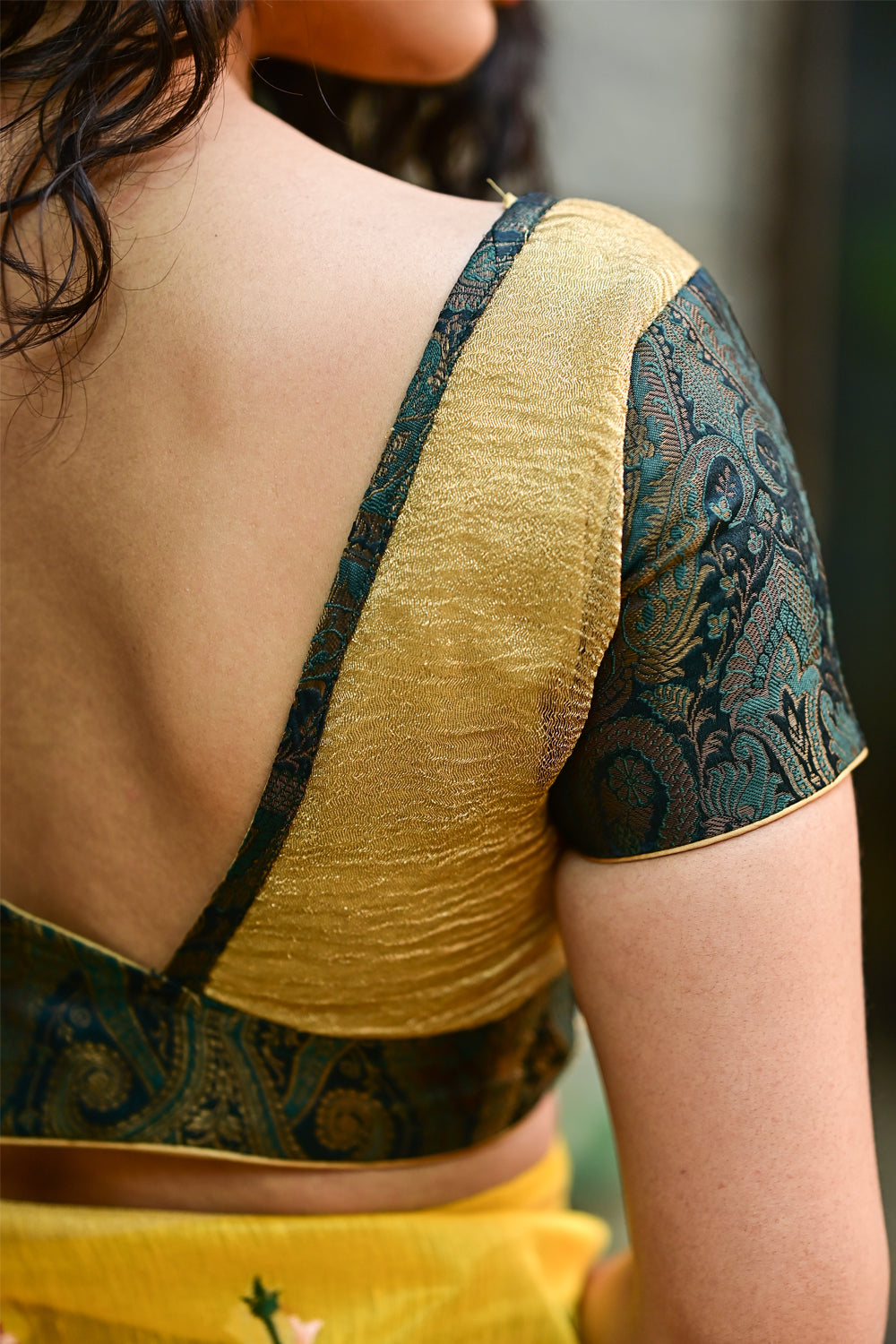 Ruched V neck blouse in crushed gold with dark green brocade sleeves