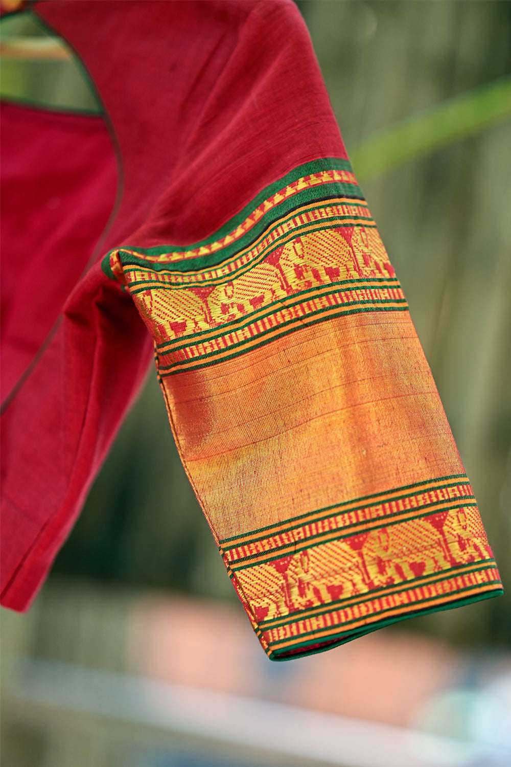 Red boatneck blouse with tie back with gold zari sleeves in narayanpet cotton